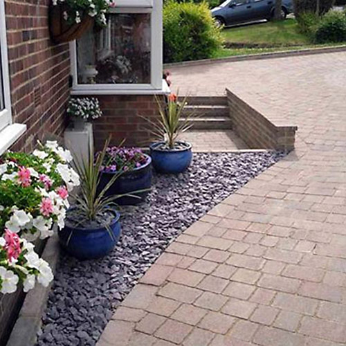Photo of block paving with plum slate infill