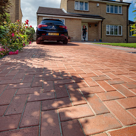 Image of new driveway using Marshall's classic paving in red
